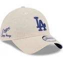 gorra-curva-beige-ajustable-con-logo-azul-9twenty-linen-spring-training-fan-pack-2025-de-los-angeles-dodgers-mlb-de-new-era