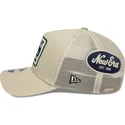 beige-trucker-keps-9forty-m-crown-a-frame-multi-patch-fran-new-era